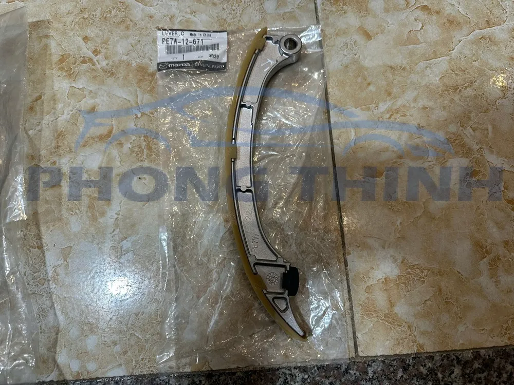 Hình ảnh sản phẩm Tỳ xích cam cong Mazda 3, Mazda 6 & CX5 2.0 chính hãng - PE7W12671